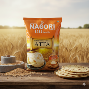 Nagori 1482 Whole Wheat Chakki Atta 10kg bag placed on wooden table with wheat grains, chakki stone and fresh rotis