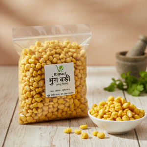 Kimart Moong Badi (Crispy Fried Moong Nuggets) 500g transparent pouch placed on wooden table with serving bowl