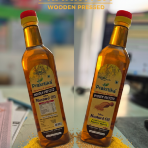 Prakrtica Wooden Pressed Yellow Mustard Oil bottles placed with mustard seeds and mustard powder on table