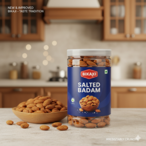 Bikaji Salted Badam almonds jar placed on kitchen counter with bowl of almonds