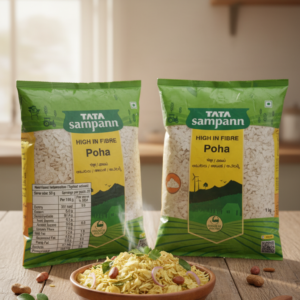 Tata Sampann High in Fibre Poha packs displayed on kitchen table with prepared poha bowl in front