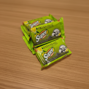 Patanjali Super Dishwash Bar small green pack placed on wooden table