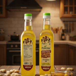 Prakritika Wooden Pressed Groundnut Oil bottles displayed on kitchen table with peanuts and oil bowl