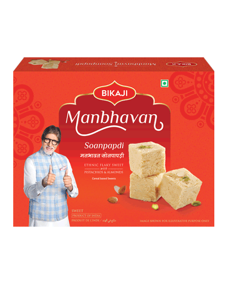 Bikaji Manbhavan Soanpapdi 500g box front and back view with pista and almond flavored flaky sweet pieces