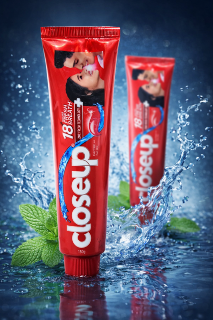 Closeup Everfresh Red Hot toothpaste 150g tube with mint leaves and water splash background