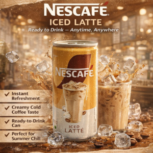 NESCAFÉ Iced Latte ready-to-drink cold coffee can placed on a desk with blurred background, showing refreshing iced coffee beverage