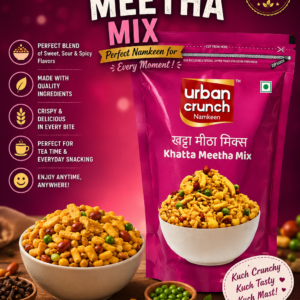 Pink packaging of Urban Crunch Namkeen Khatta Meetha Mix with a bowl of crunchy snack mix displayed on the front in a resealable pouch.