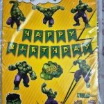 Superhero-themed Happy Birthday decoration combo set featuring a Happy Birthday banner, character cutouts, face mask, and party decorations in bright yellow packaging.